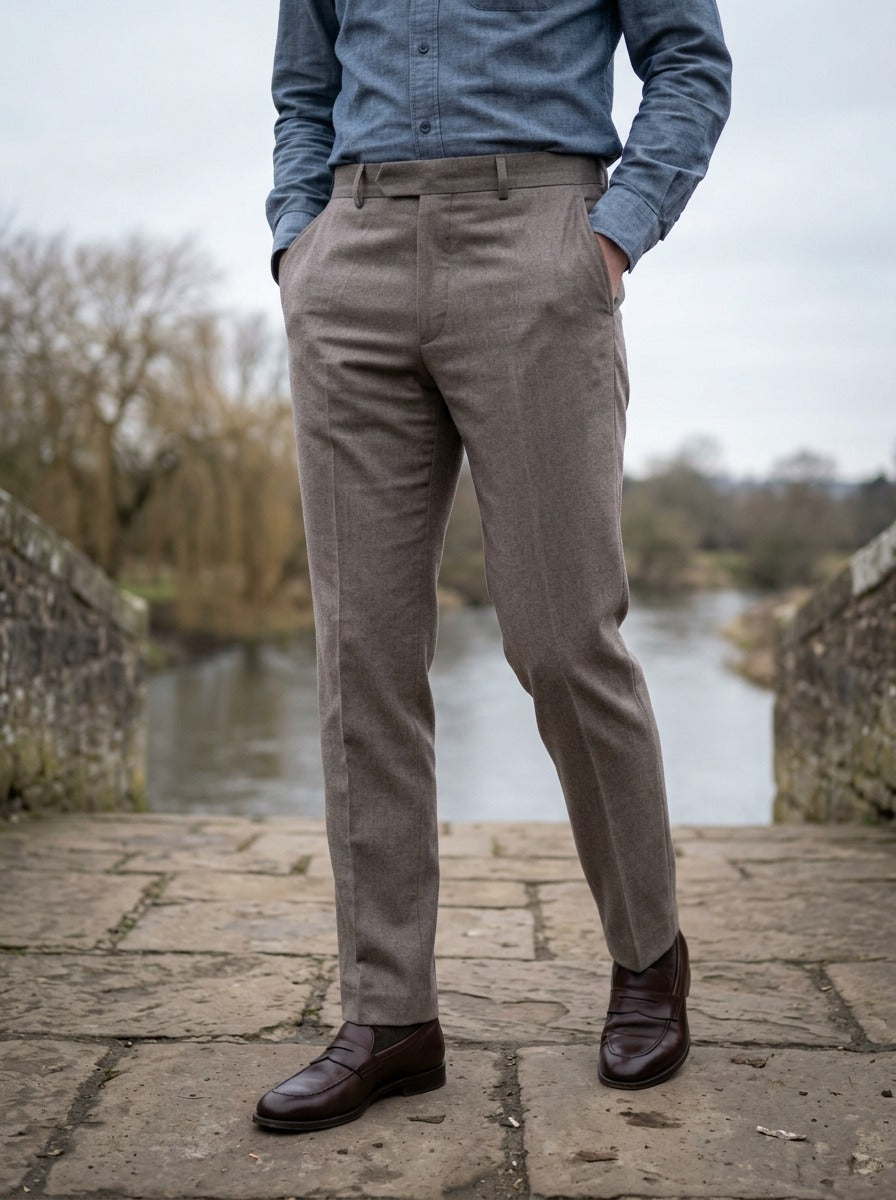 Lansing brushed trousers in Grey, lifestyle on a stone footbridge, Gentlemens Manor