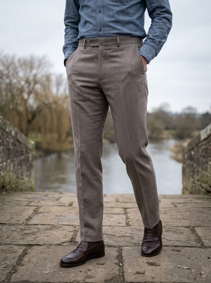 Lansing brushed trousers in Grey, lifestyle on a stone footbridge, Gentlemens Manor