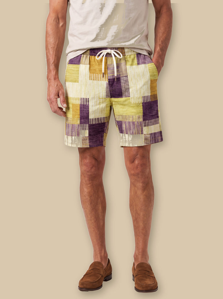 Lennox summer shorts in Mustard, worn by a model on a warm sand studio background - Gentlemens Manor