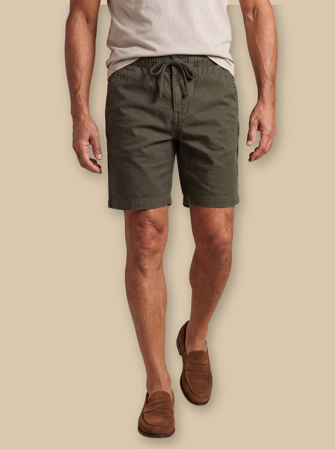 Lester summer shorts in Green, worn by a model on a warm sand studio background - Gentlemens Manor