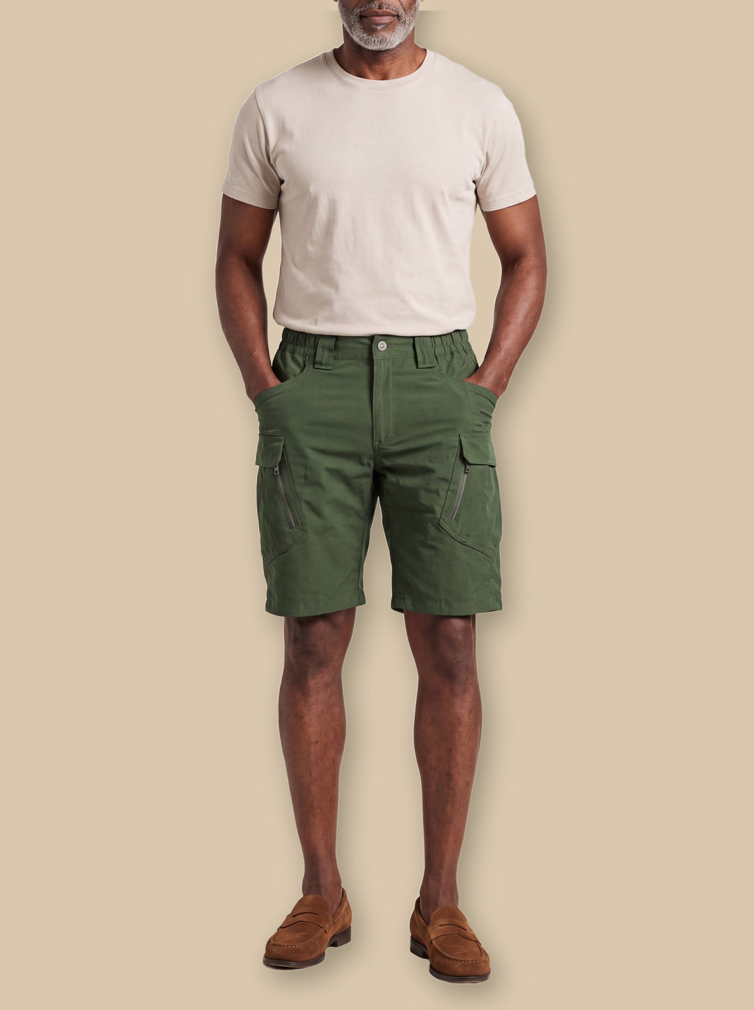 Levi summer shorts in Green, worn by a model on a warm sand studio background - Gentlemens Manor