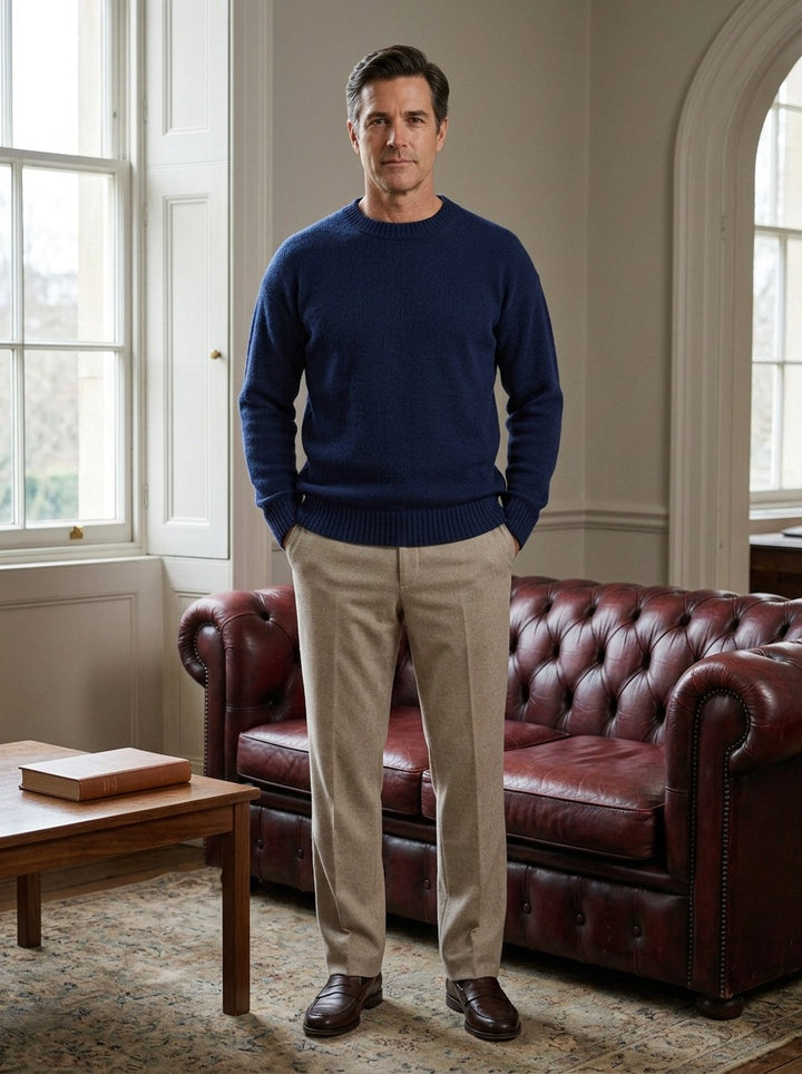 Linford sweater in Navy, lifestyle in a club reading room, Gentlemens Manor