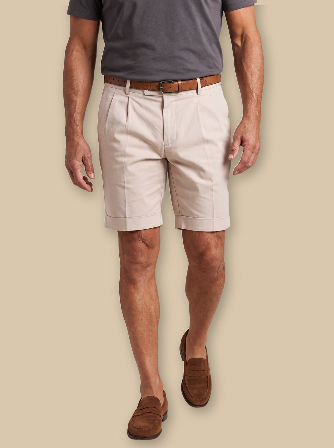 Lionel summer shorts in Beige, worn by a model on a warm sand studio background - Gentlemens Manor