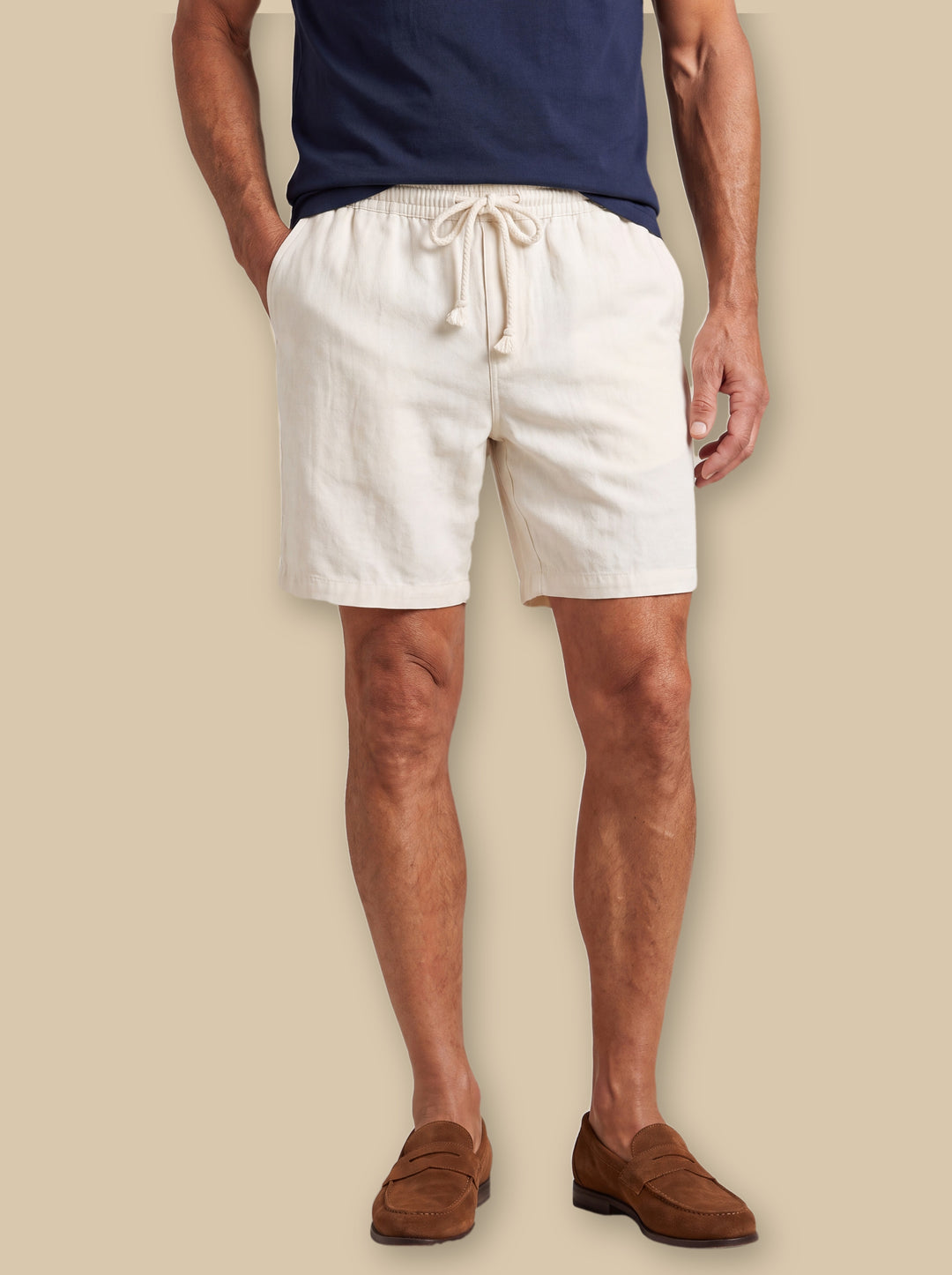 Logan summer shorts in White, worn by a model on a warm sand studio background - Gentlemens Manor