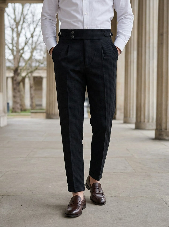 Lowry textured pleated trousers in Black, lifestyle in a stone colonnade, Gentlemens Manor