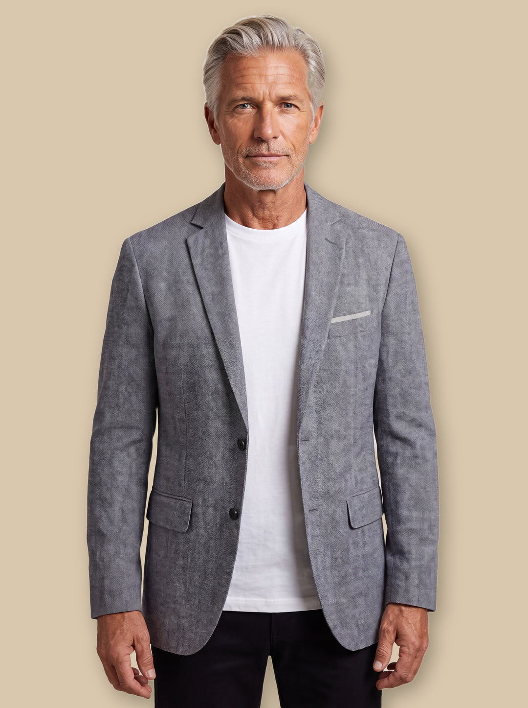 Lyman blazer suit in Grey, worn by a model on a warm sand studio background - Gentlemens Manor