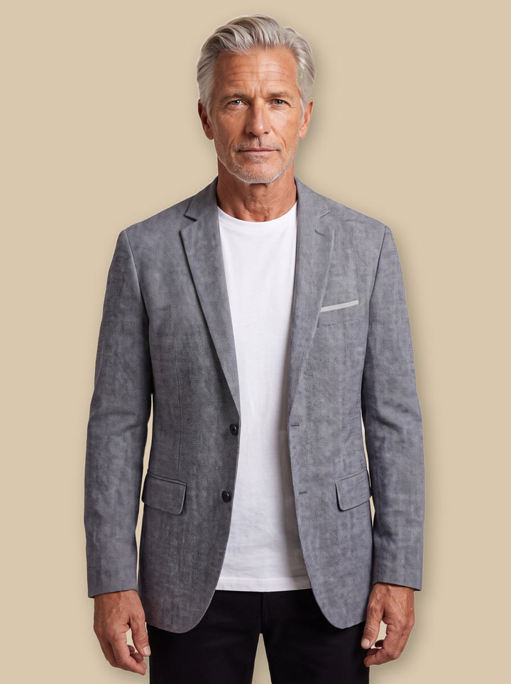 Lyman blazer suit in Grey, worn by a model on a warm sand studio background - Gentlemens Manor