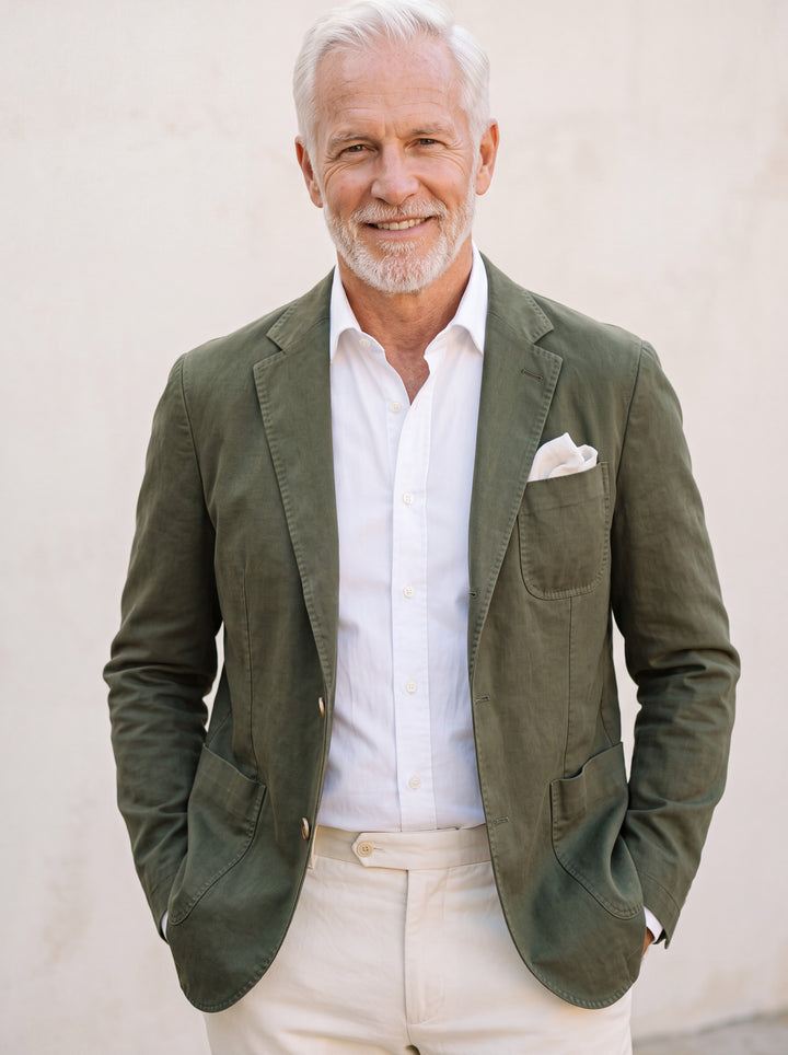 Marcus blazer in Olive, worn by a model in a Mediterranean setting - Gentlemens Manor lifestyle