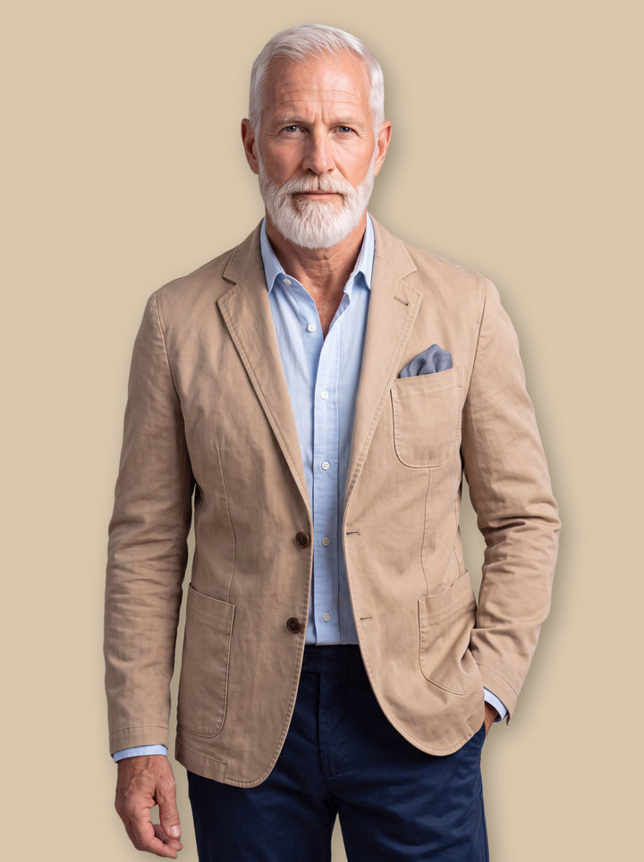 Marcus blazer suit in Sand, worn by a model on a warm sand studio background - Gentlemens Manor