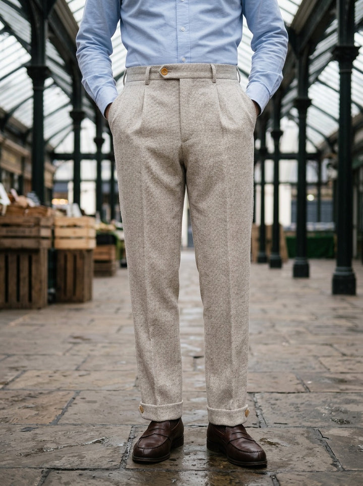 Marston herringbone buttoned cuff trousers in Beige, lifestyle in a covered market hall, Gentlemens Manor