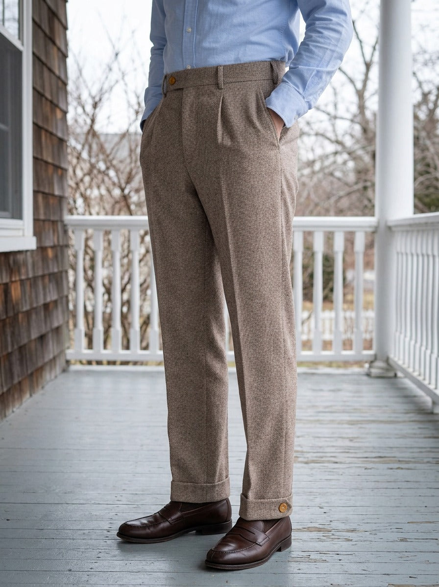 Marston herringbone buttoned cuff trousers in Brown, lifestyle on a covered porch, Gentlemens Manor