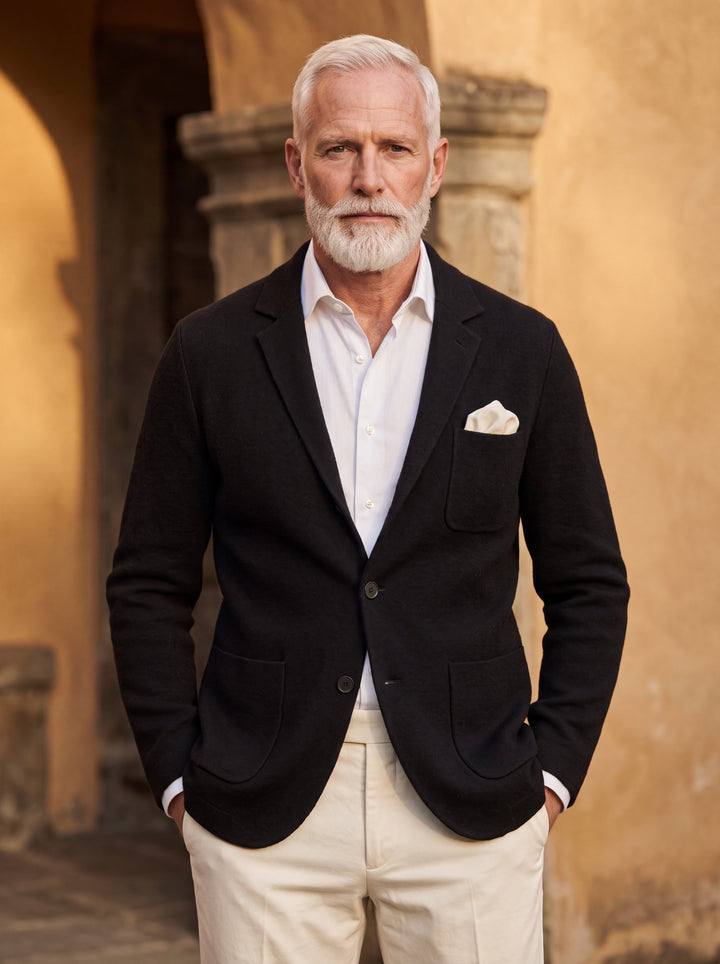 Martin blazer in Black, worn by a model in a Mediterranean setting - Gentlemens Manor lifestyle