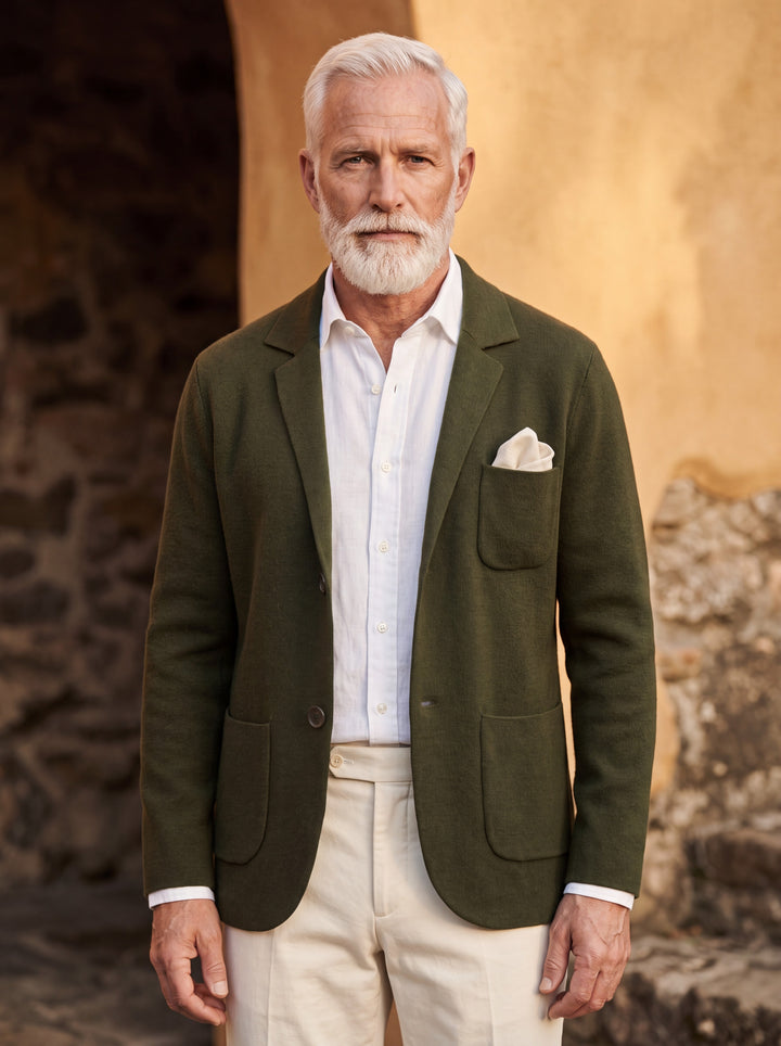 Martin blazer in Olive, worn by a model in a Mediterranean setting - Gentlemens Manor lifestyle