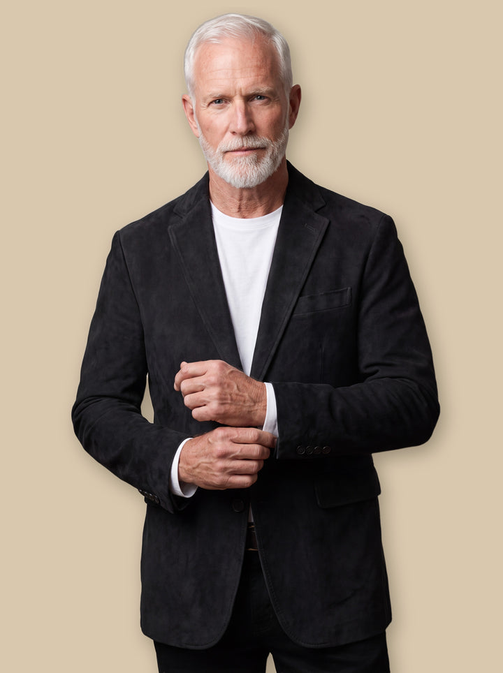 Mason blazer suit in Black, worn by a model on a warm sand studio background - Gentlemens Manor