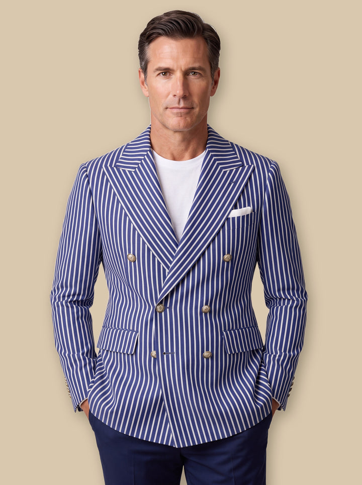 Maurice blazer suit in Blue, worn by a model on a warm sand studio background - Gentlemens Manor