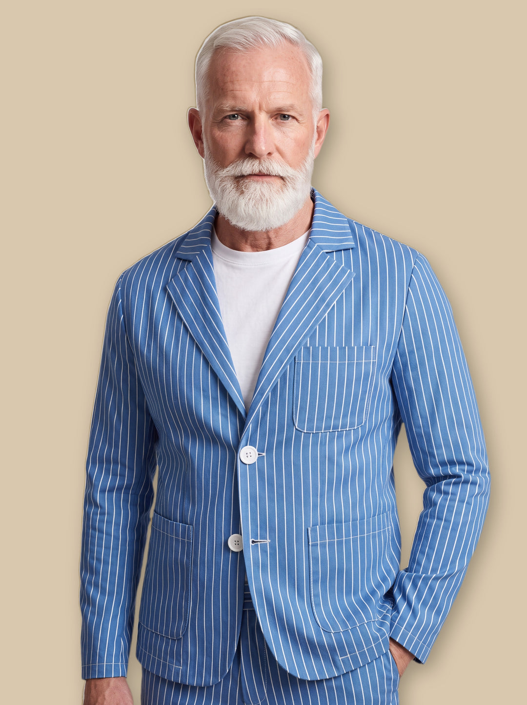 Maynard blazer suit in Blue, worn by a model on a warm sand studio background - Gentlemens Manor