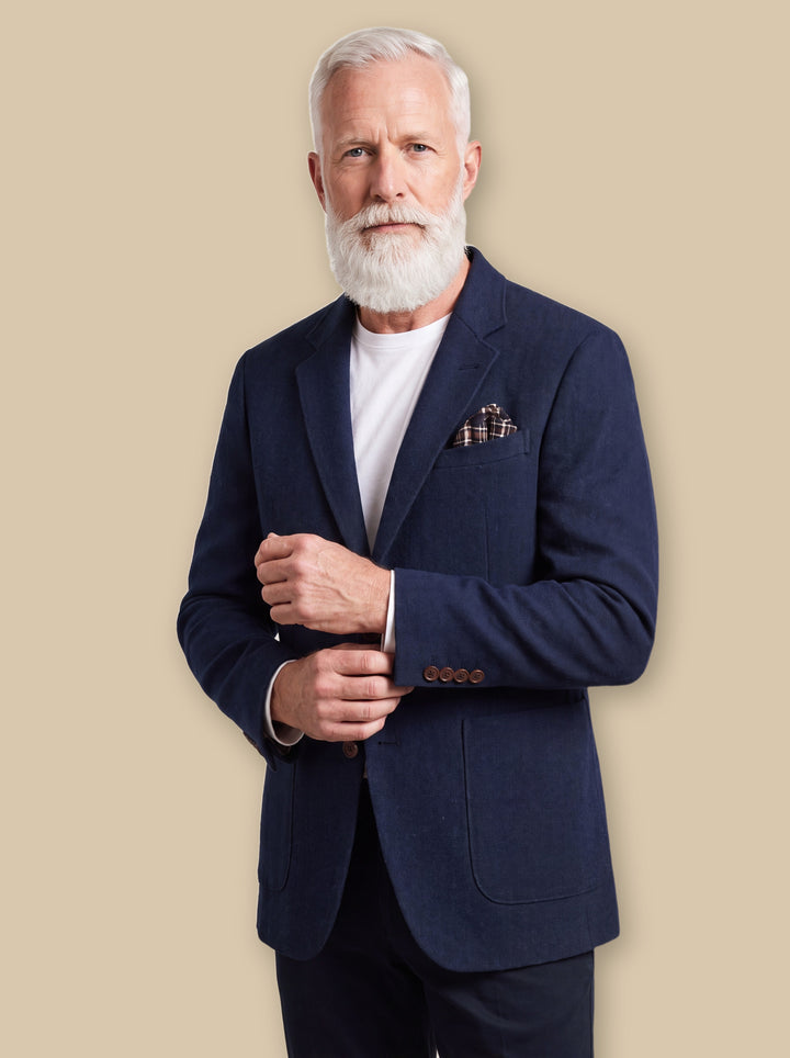 Melvin blazer suit in Navy, worn by a model on a warm sand studio background - Gentlemens Manor