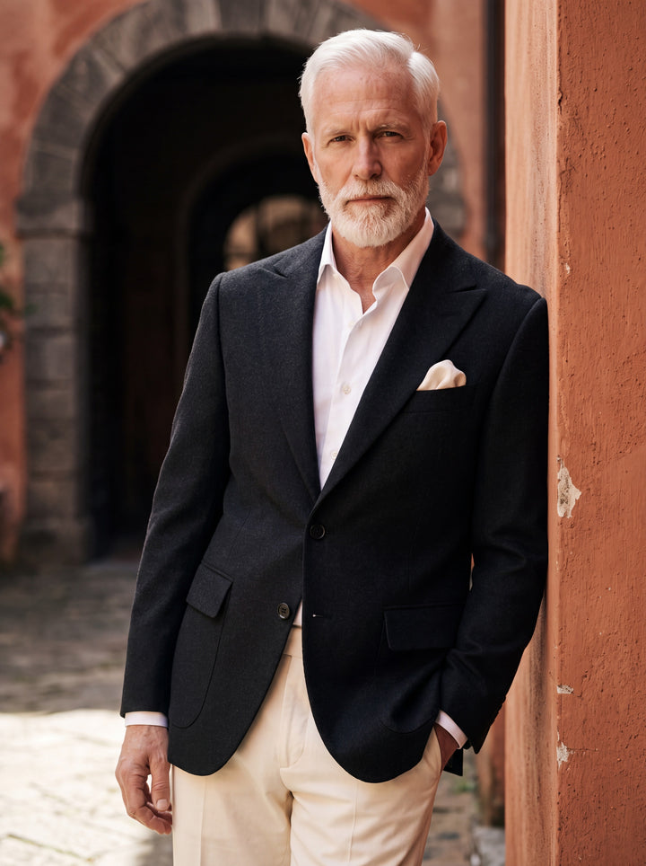 Mercer blazer in Black, worn by a model in a Mediterranean setting - Gentlemens Manor lifestyle