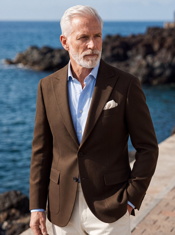 Mercer blazer in Brown, worn by a model in a Mediterranean setting - Gentlemens Manor lifestyle