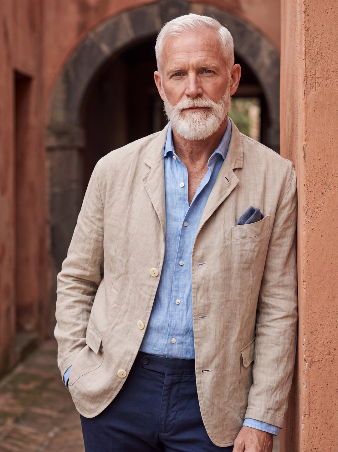 Merle blazer in Sand, worn by a model in a Mediterranean setting - Gentlemens Manor lifestyle