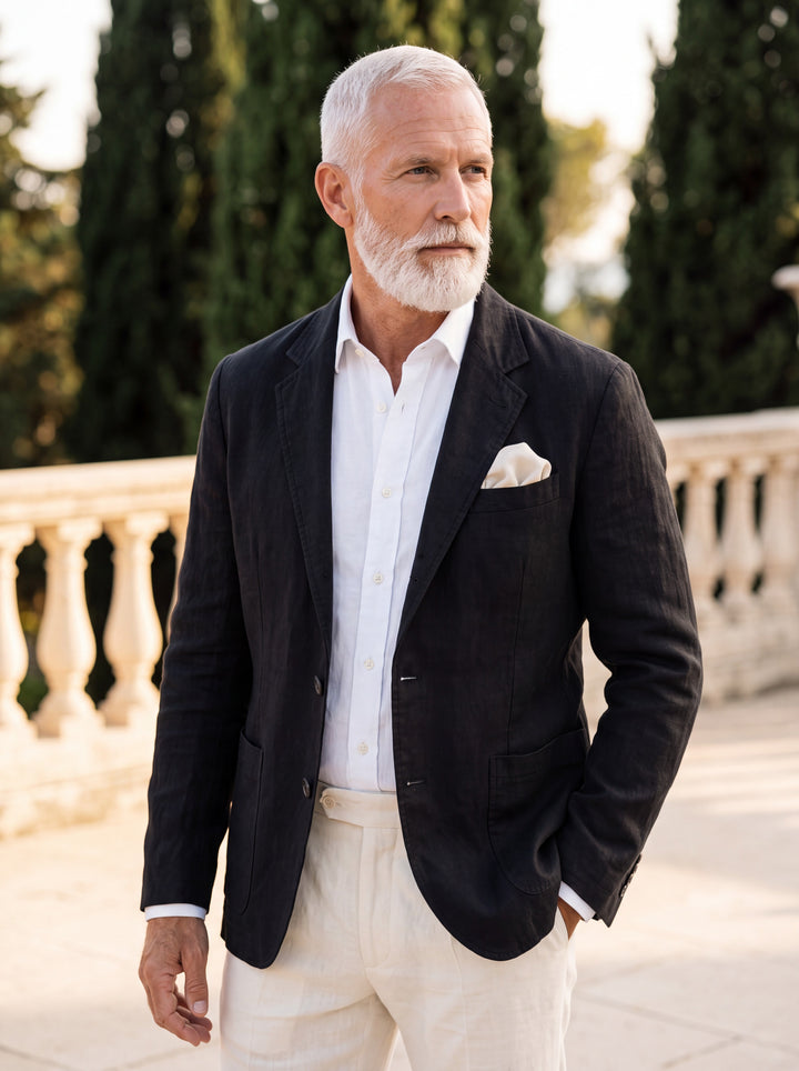 Merritt blazer in Black, worn by a model in a Mediterranean setting - Gentlemens Manor lifestyle