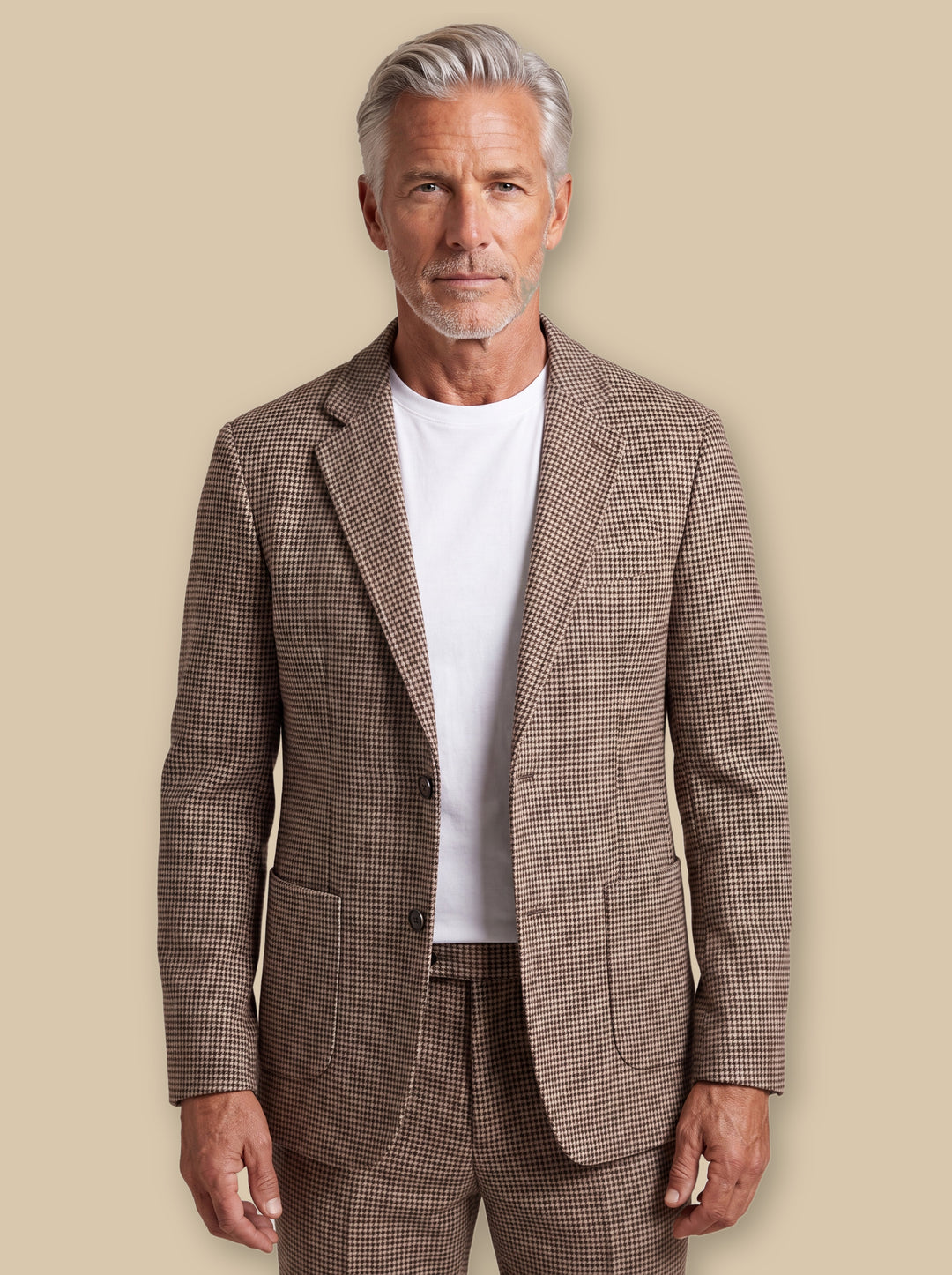Miles blazer suit in Brown, worn by a model on a warm sand studio background - Gentlemens Manor