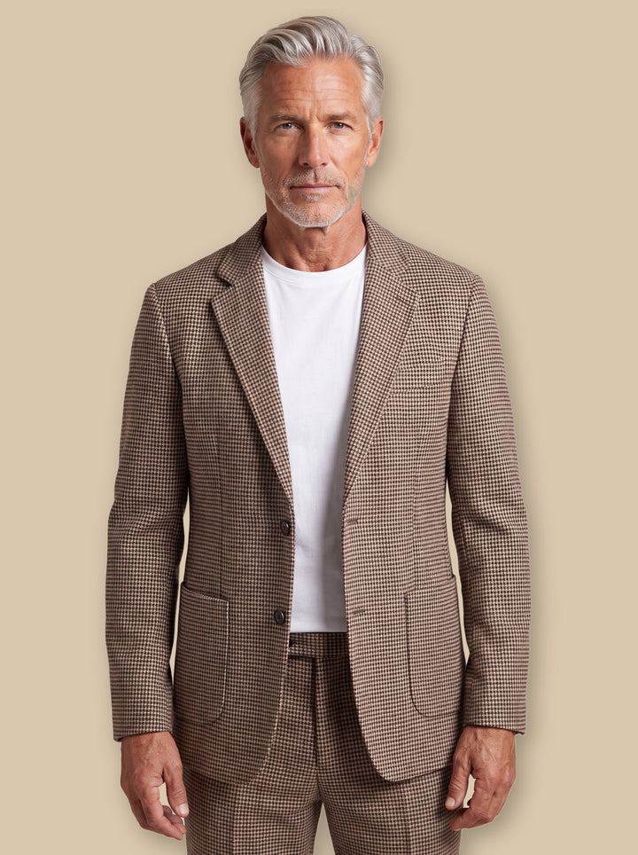 Miles blazer suit in Brown, worn by a model on a warm sand studio background - Gentlemens Manor