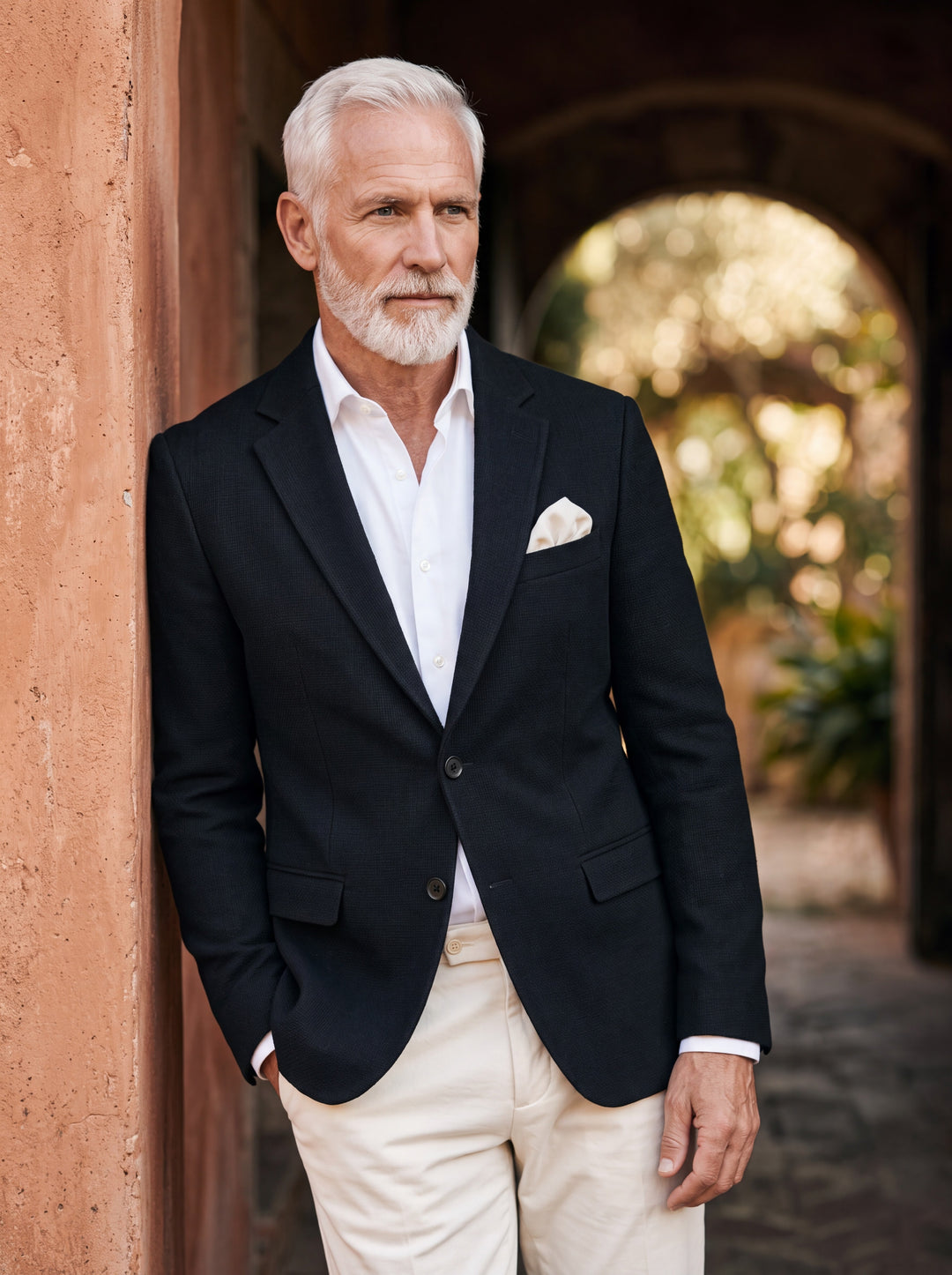 Montgomery blazer in Black, worn by a model in a Mediterranean setting - Gentlemens Manor lifestyle