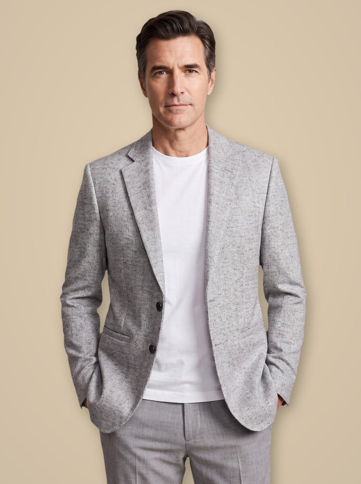 Montgomery blazer suit in Light Grey, worn by a model on a warm taupe studio background - Gentlemens Manor