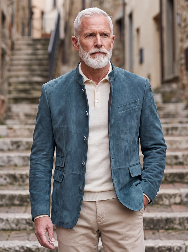 Morton jacket in Blue, worn by a model in a Mediterranean setting - Gentlemens Manor lifestyle