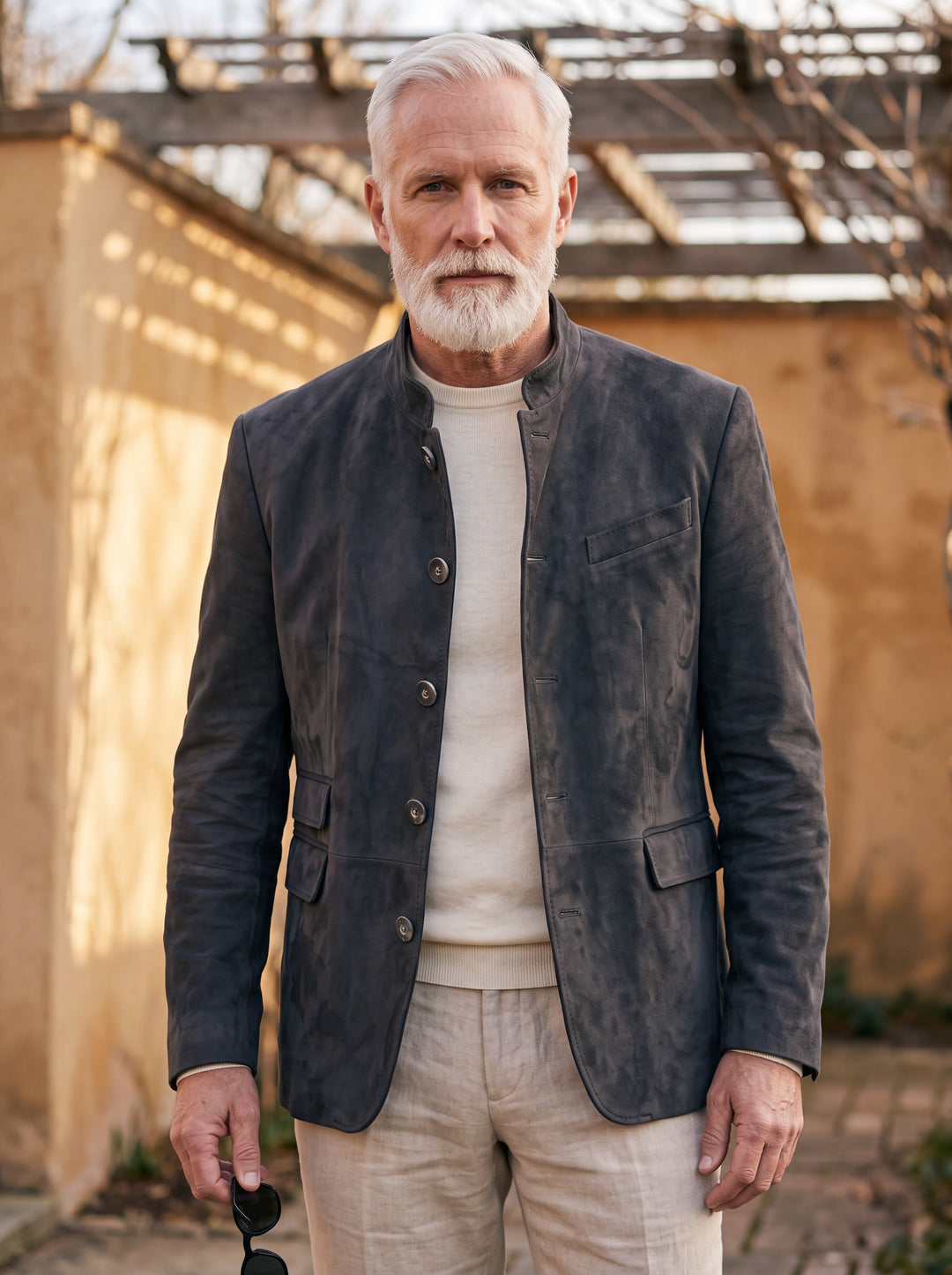 Morton jacket in Charcoal, worn by a model in a Mediterranean setting - Gentlemens Manor lifestyle
