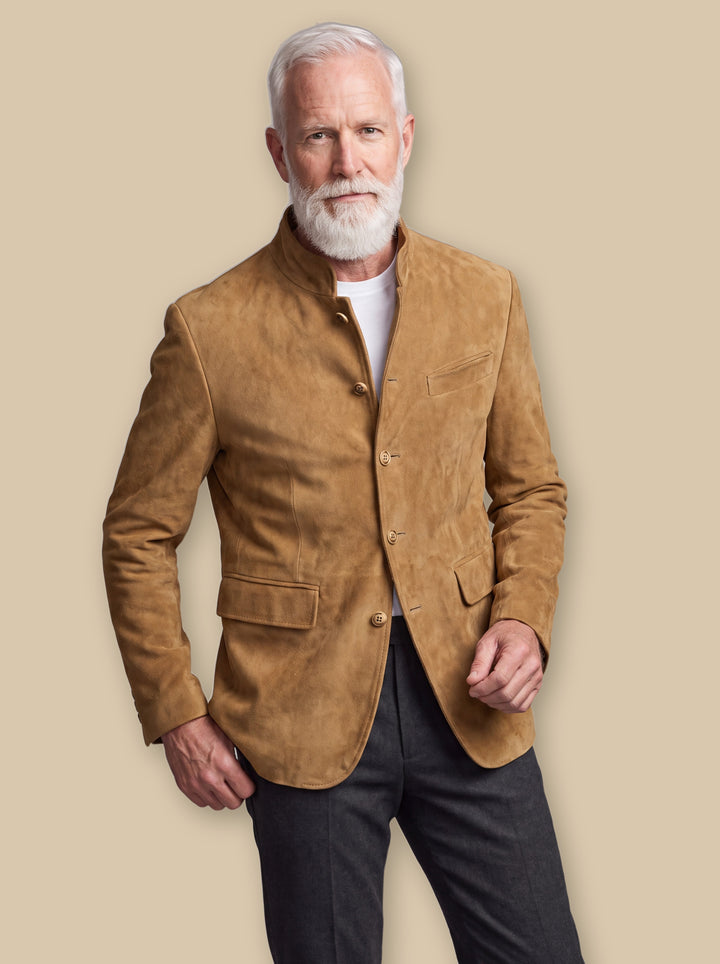 Morton jacket in Sand, worn by a model on a warm sand studio background - Gentlemens Manor