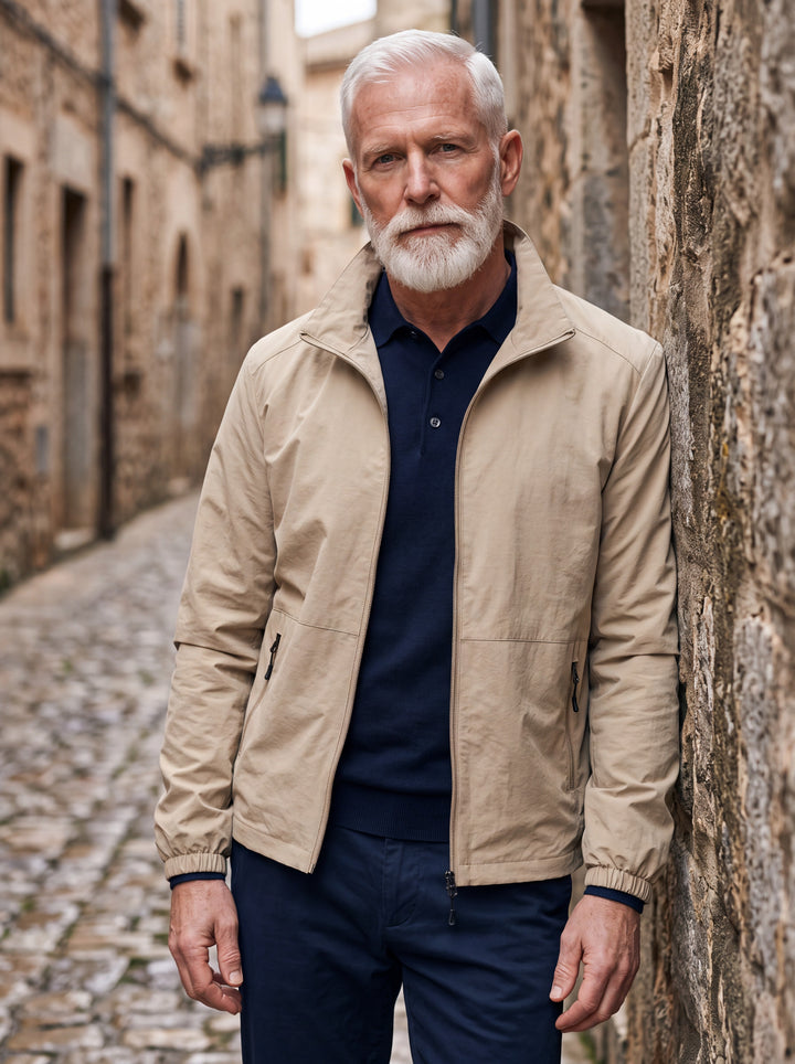 Moses jacket in Sand, worn by a model in a Mediterranean setting - Gentlemens Manor lifestyle