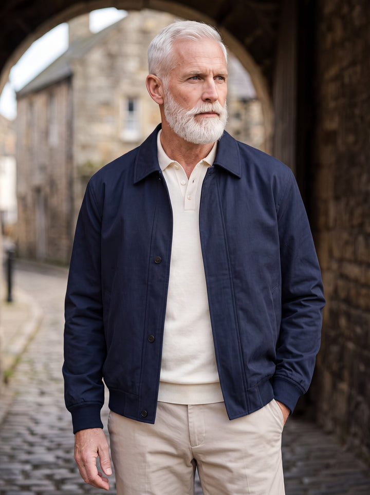 Myron jacket in Navy, worn by a model in a Mediterranean setting - Gentlemens Manor lifestyle