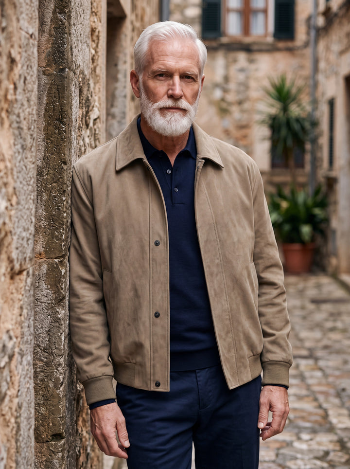 Myron jacket in Sand, worn by a model in a Mediterranean setting - Gentlemens Manor lifestyle