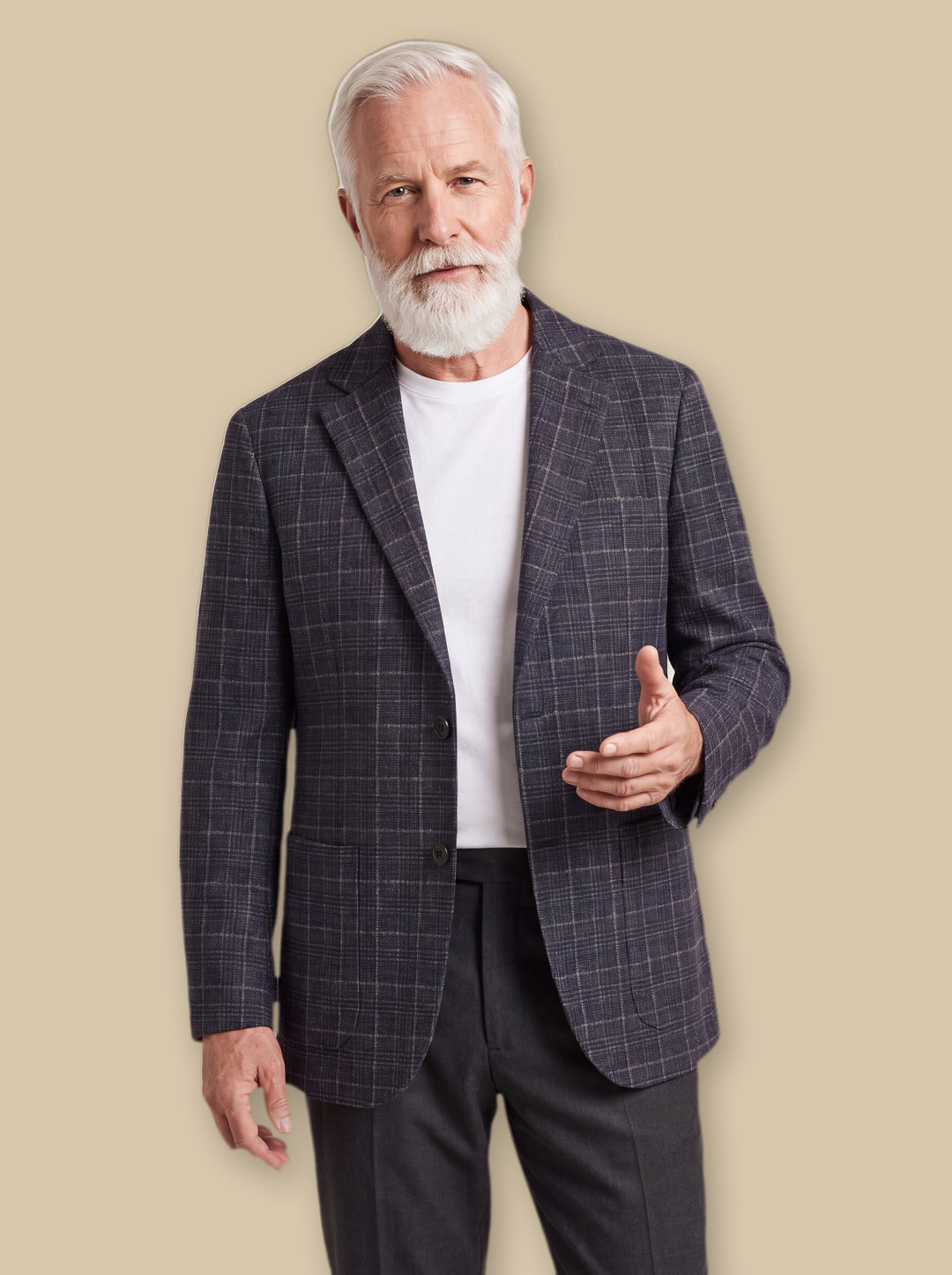 Napoleon jacket in Navy, worn by a model on a warm sand studio background - Gentlemens Manor
