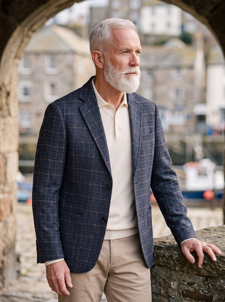 Napoleon jacket in Navy, worn by a model in a Mediterranean setting - Gentlemens Manor lifestyle