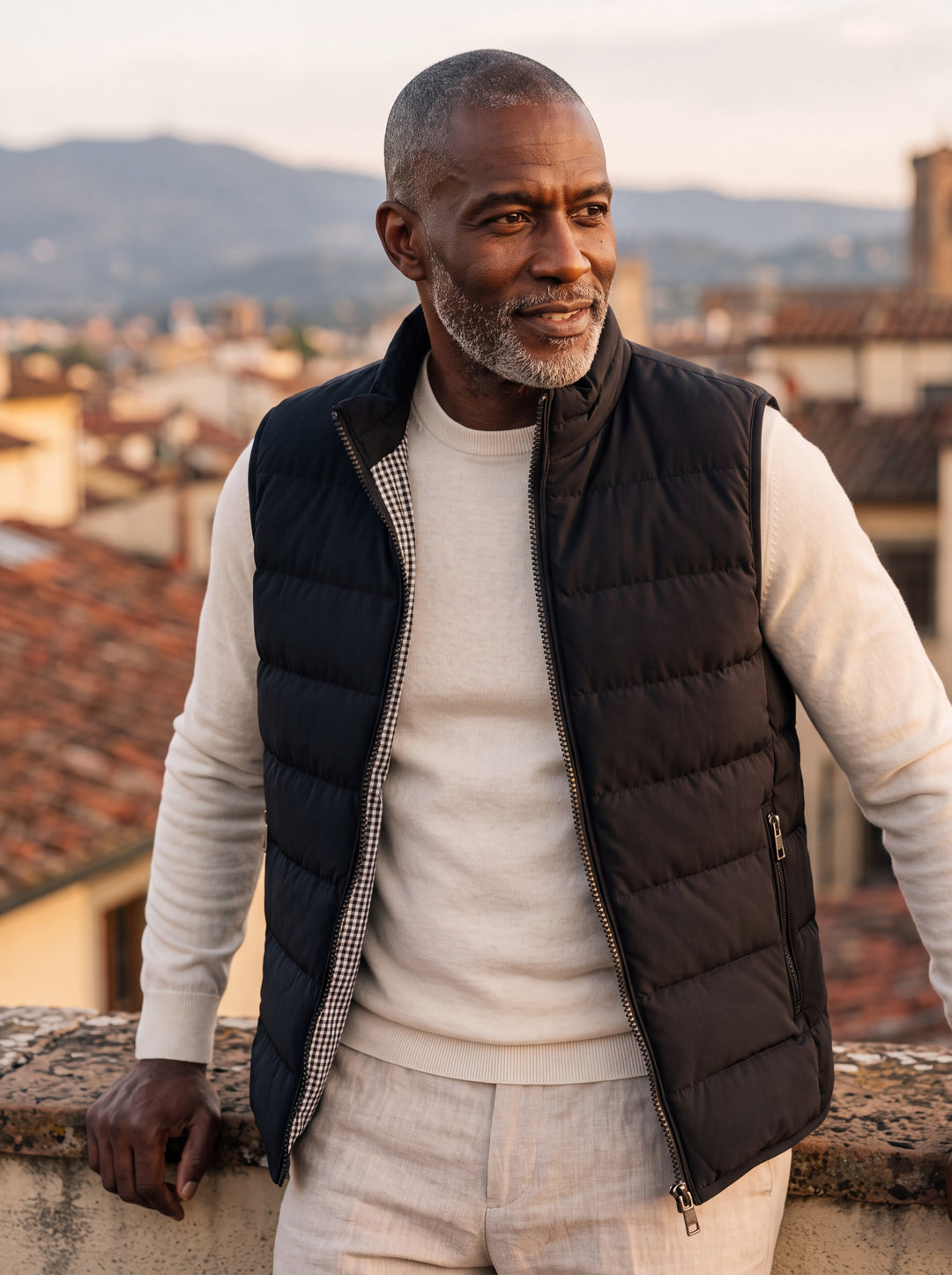 Nathaniel vest in Black, worn by a model in a Mediterranean setting - Gentlemens Manor lifestyle