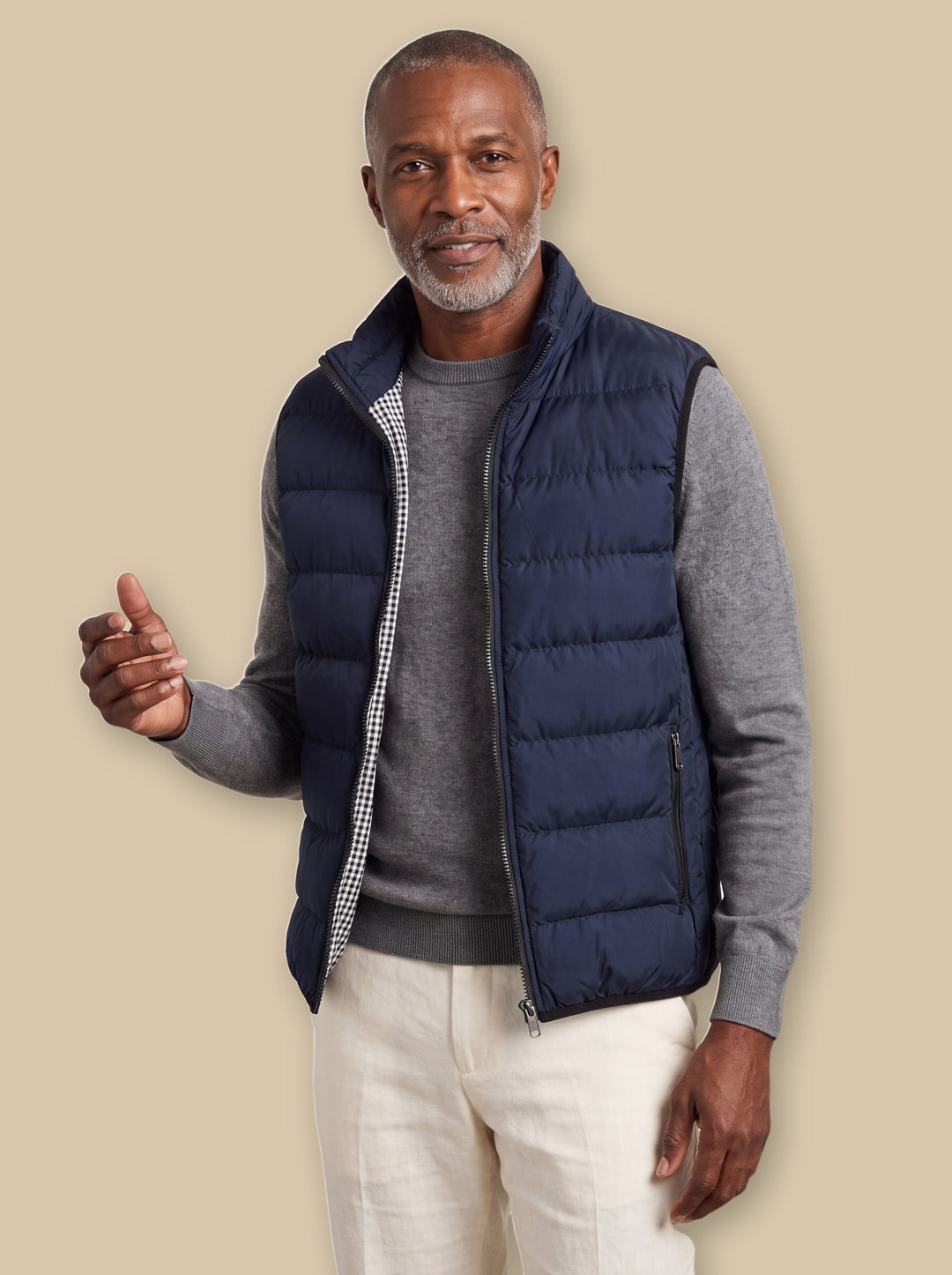 Nathaniel vest in Navy, worn by a model on a warm sand studio background - Gentlemens Manor