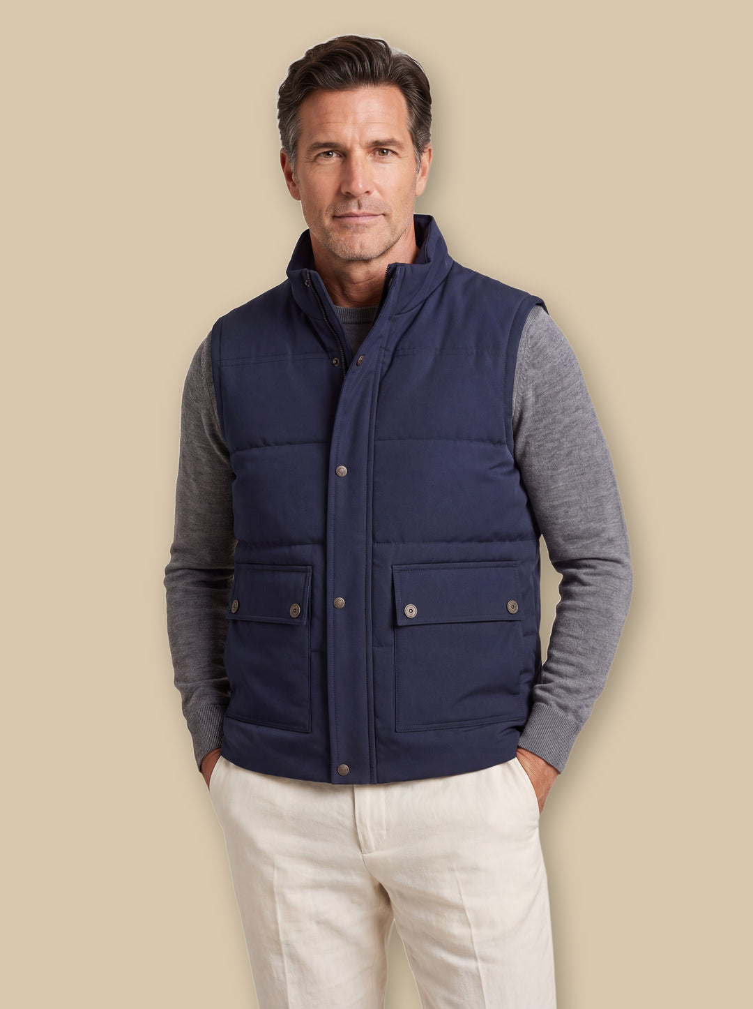 Ned vest in Blue, worn by a model on a warm sand studio background - Gentlemens Manor