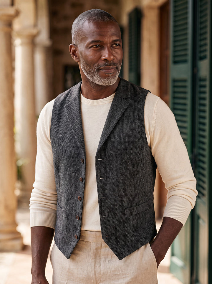 Nelson vest in Charcoal, worn by a model in a Mediterranean setting - Gentlemens Manor lifestyle