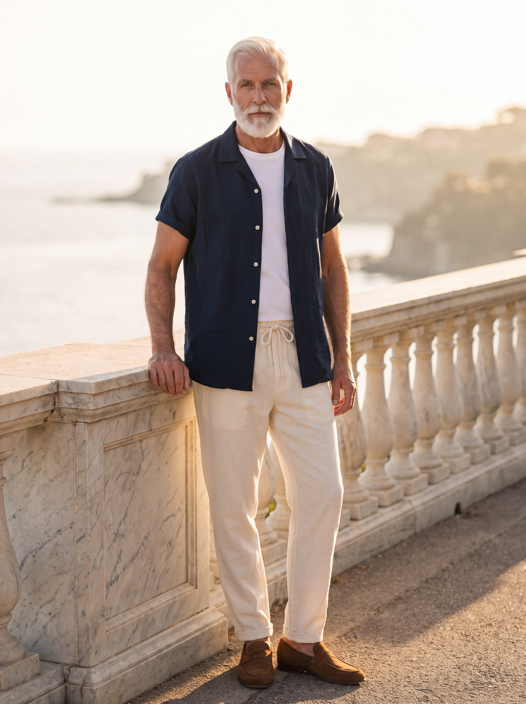 Nelson Men two piece set in blue, worn by a model on a Mediterranean terrace - Gentlemens Manor lifestyle
