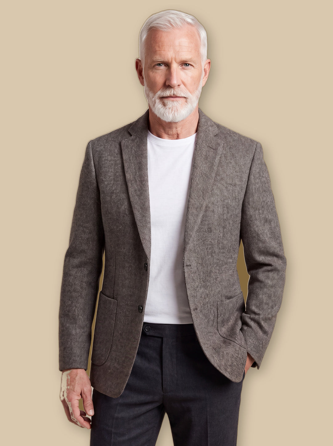 Nicholas jacket in Brown, worn by a model on a warm sand studio background - Gentlemens Manor