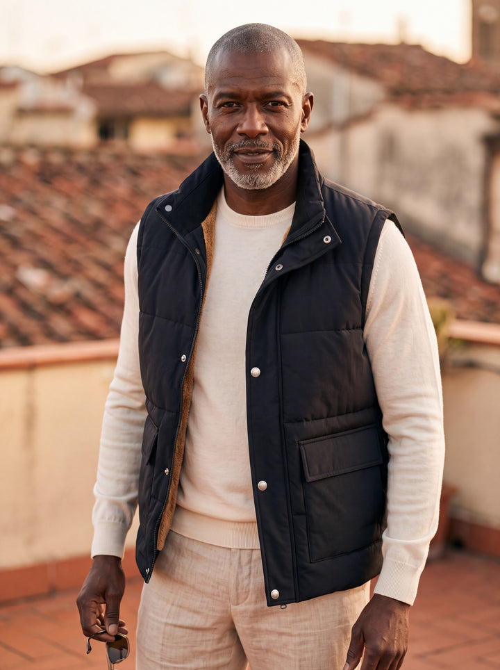 Nigel vest in Black, worn by a model in a Mediterranean setting - Gentlemens Manor lifestyle