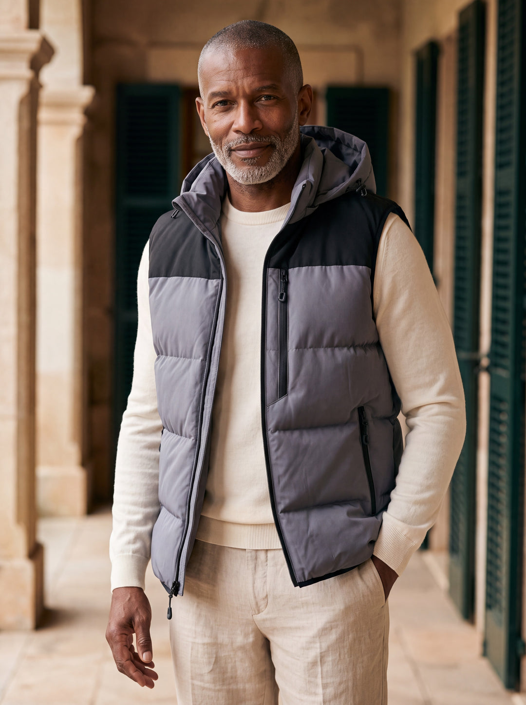 Noah vest in Grey, worn by a model in a Mediterranean setting - Gentlemens Manor lifestyle