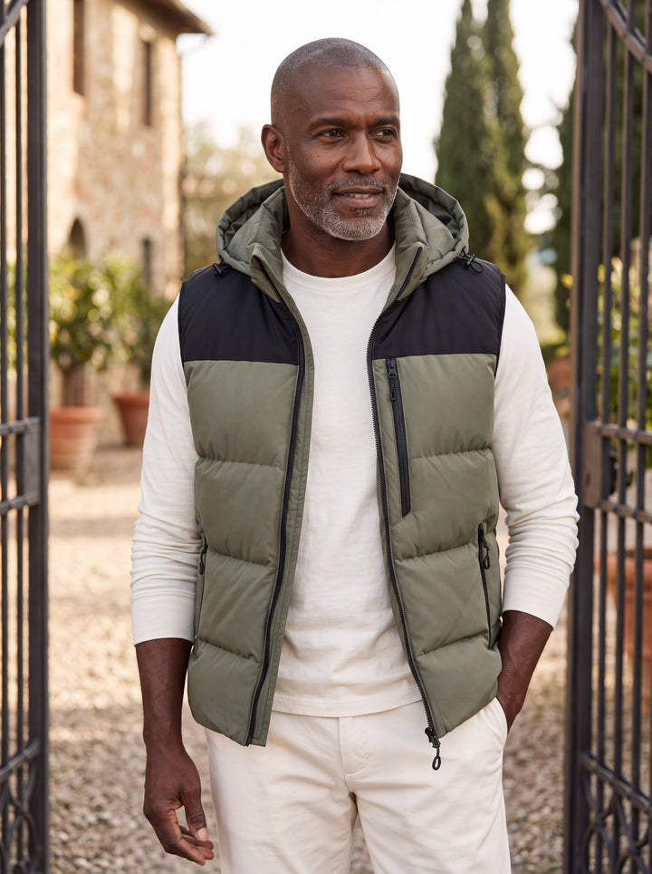 Noah vest in Olive, worn by a model in a Mediterranean setting - Gentlemens Manor lifestyle