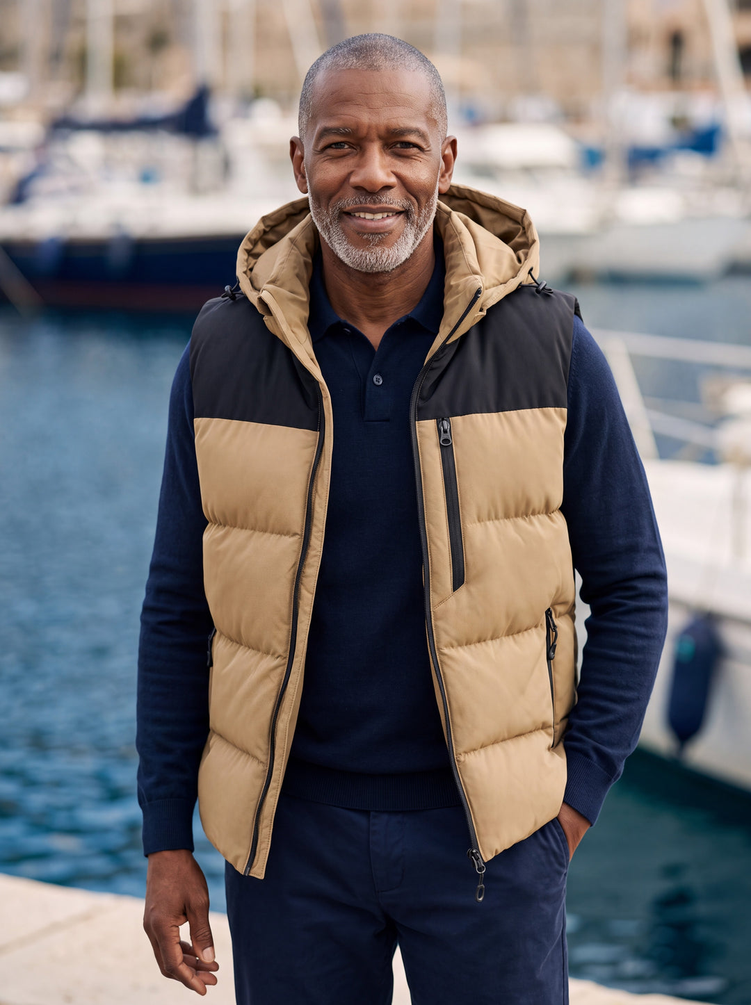 Noah vest in Sand, worn by a model in a Mediterranean setting - Gentlemens Manor lifestyle