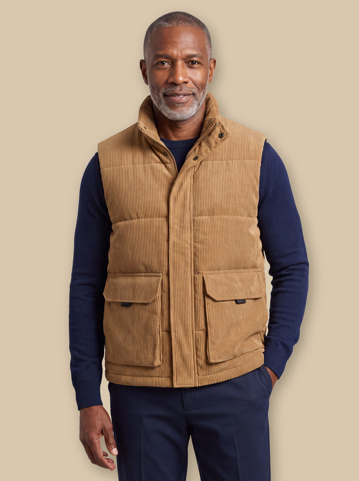 Noble vest in Sand, worn by a model on a warm sand studio background - Gentlemens Manor