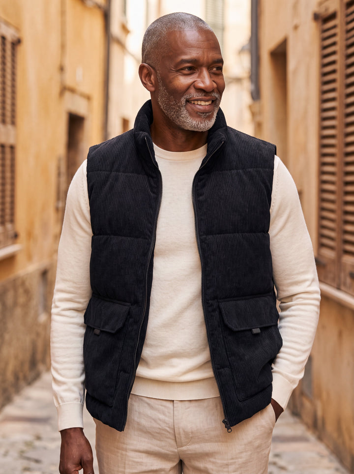Nolan vest in Black, worn by a model in a Mediterranean setting - Gentlemens Manor lifestyle