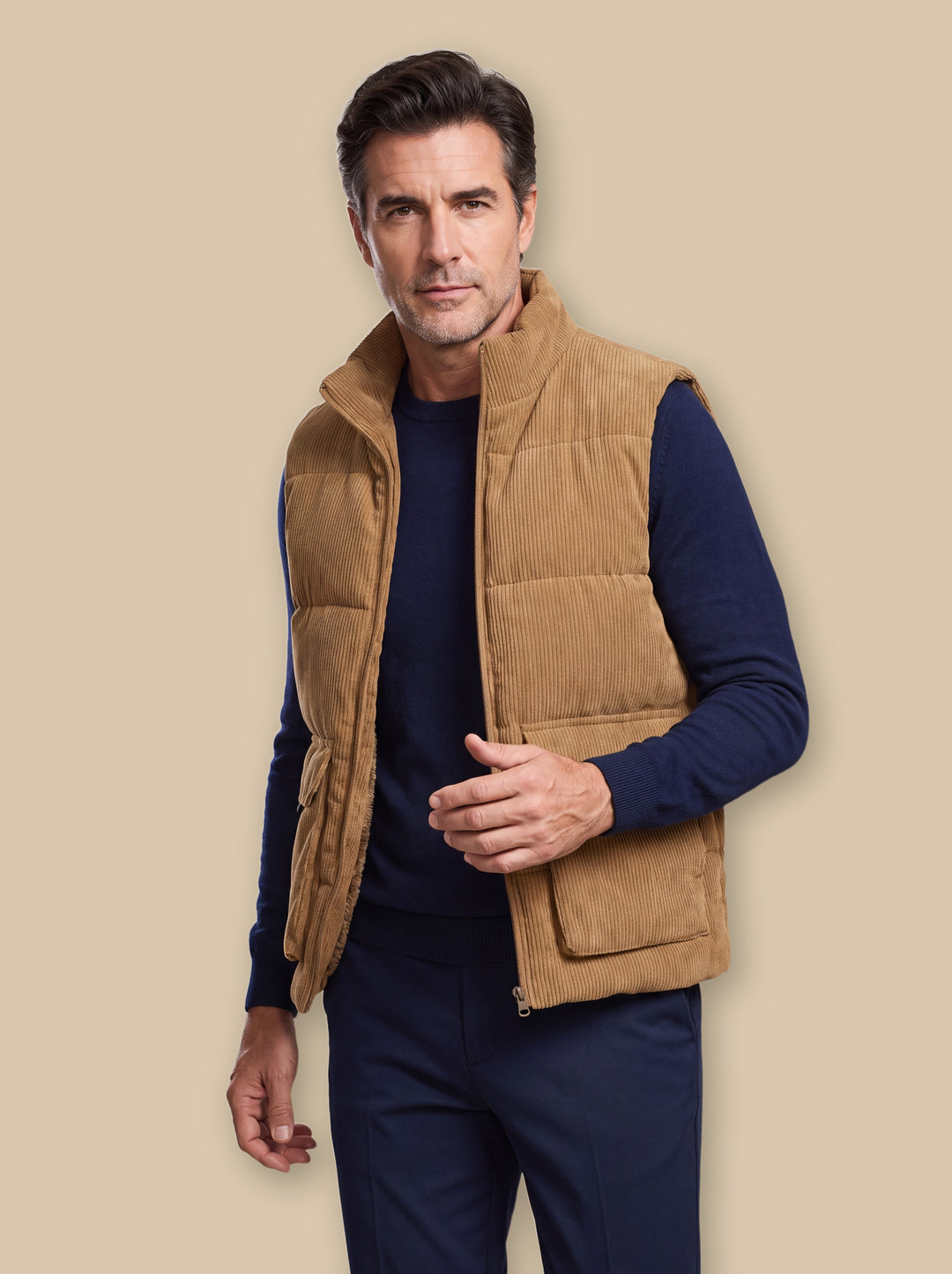 Nolan vest in Camel, worn by a model on a warm sand studio background - Gentlemens Manor